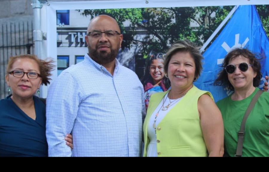 Three people pose for a group picture