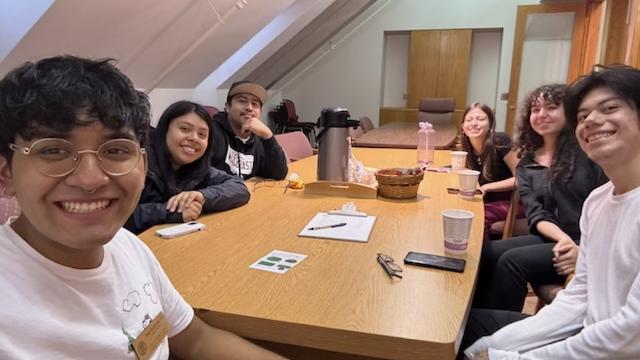 Students gathered around a table