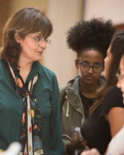Picture of Professor Maria Cristina with students